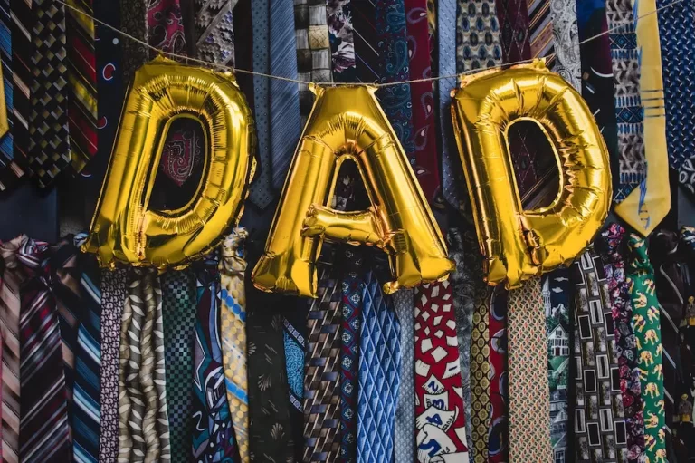 Dad balloons with a tie background