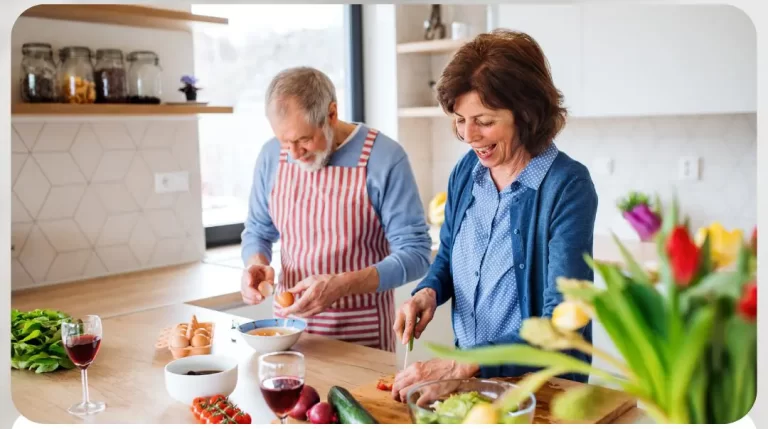 senior couple chopping vegetables
